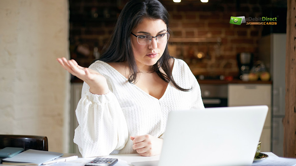 Business owner reviewing Merchant Account Application Denied on a laptop
